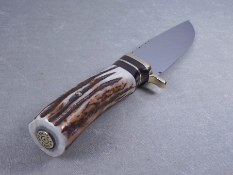 Casing shell inserted into butt end of elk horn knife