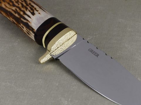 Dimpled brass dropped guard on elk hunting knife