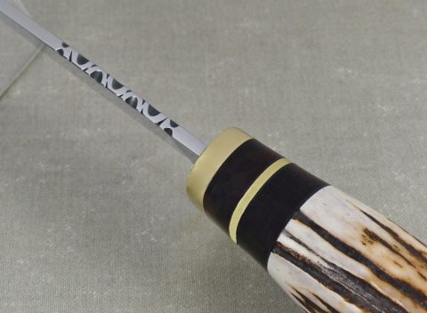 Filework on spine of elk horn hunting knife