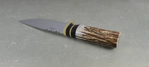 Front view of elk horn hunting knife showing ironwood spacers