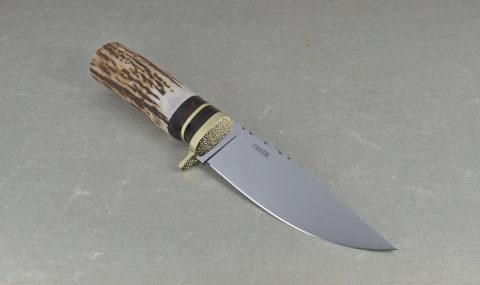 Top view of drop point blade on elk horn hunting knife